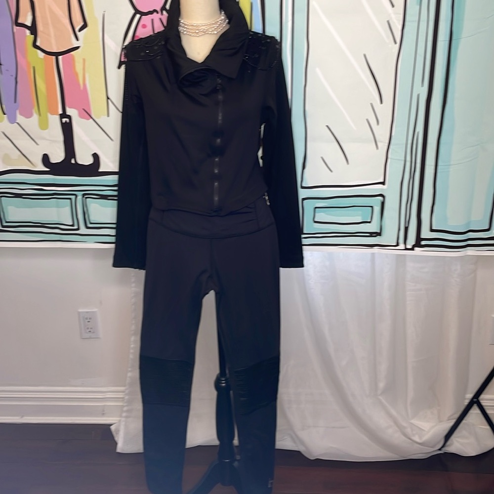 Dressy work out outfit with chains on jacket and fake leather on the knees